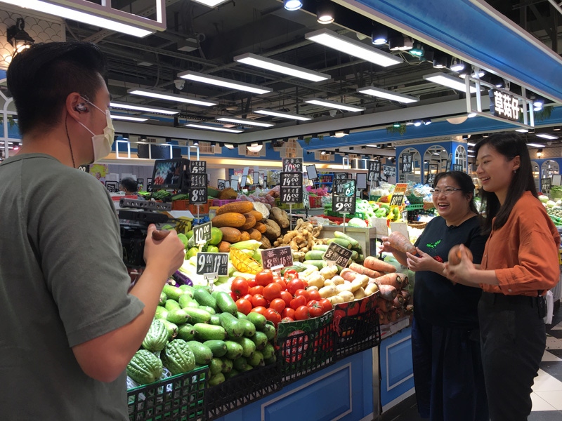 people in supermarket